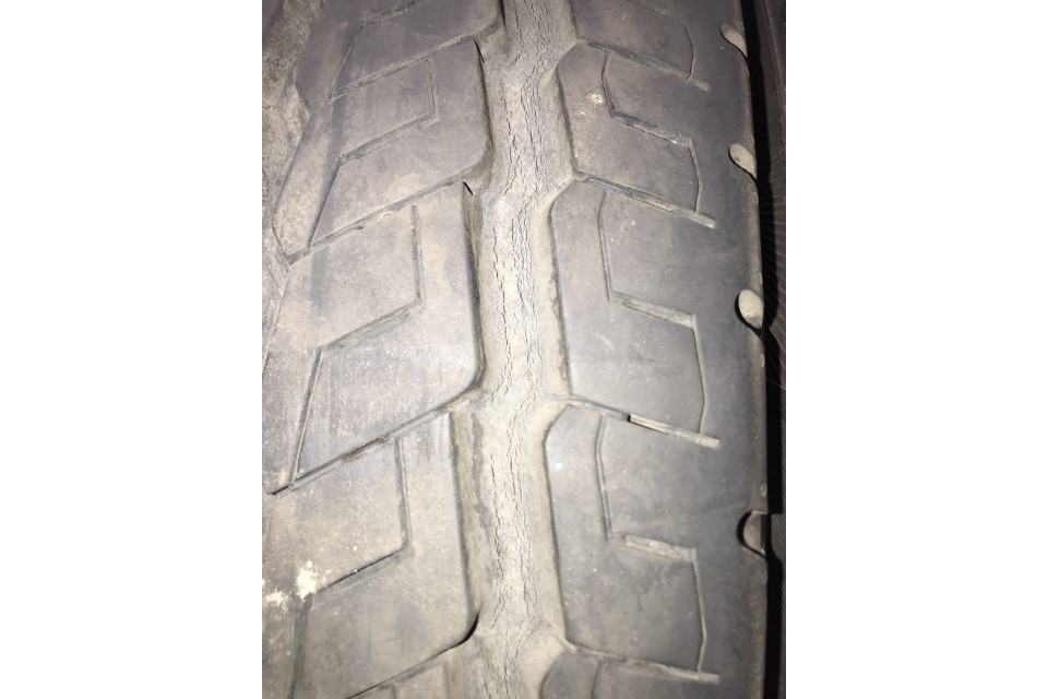Minor cracking in grooves, no cords exposed