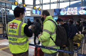 Embassy staff at Santiago airport helping to repatriate British tourists stranded in Chile.