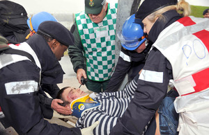 Naval medics and Welsh Ambulance Service personnel deal with a casualty during a Military Aid to the Civil Community exercise