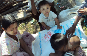 Survivors of the cyclone receiving emergency food aid from the World Food Programme (WFP) thanks to British support. Picture: WFP