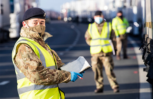 British Army Royal Engineers deliver Covid-19 tests to European lorry drivers on the M20 in Kent.