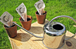 Watering can and money