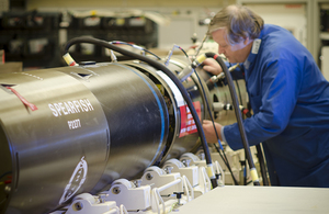 Image depicts a man working on a Spearfish missile.