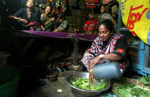 Ranu Begum prepares food for her family with clean water. Picture: Charlie Bibby/FT courtesy of WaterAid