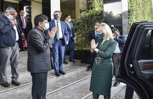 International Trade Secretary Liz Truss and Indian Minister for Commerce and Industry Piyush Goyal bowing to eachother