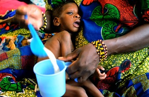 Mariama feeds her 18-month-old daughter, Salaha, therapeutic milk. Picture: Rachel Palmer/Save the Children