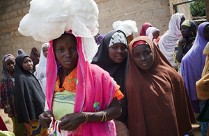 A woman in Nigeria who has just received her two free bed nets. Picture: William Daniels for Malaria Consortium