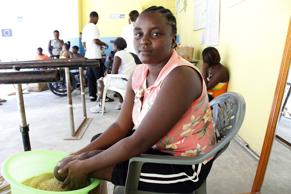 Sanise, aged 32, massages her stump with dry rice in order to get it used to rubbing movements. Picture: Russell Watkins/DFID