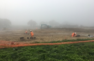 Thumbnail - Working in the mist archaeological dig.