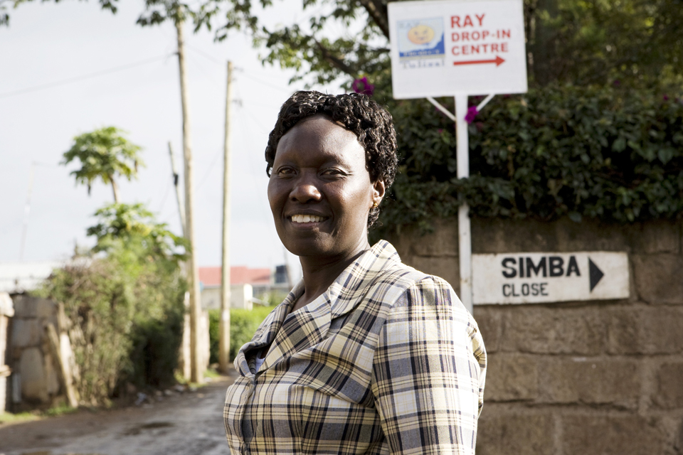 A community mobiliser at the entrance to the Ray Drop-In Centre in Rongai, Nairobi. Picture: Nell Freeman/Alliance
