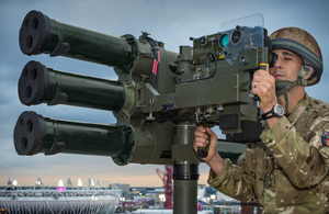 British Army soldier operating the Lightweight Multiple Launcher (LML) tripod system.