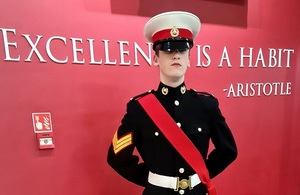 Lee Robinson dressed in full seal Lord Cadet uniform standing to attention in front of the camera.