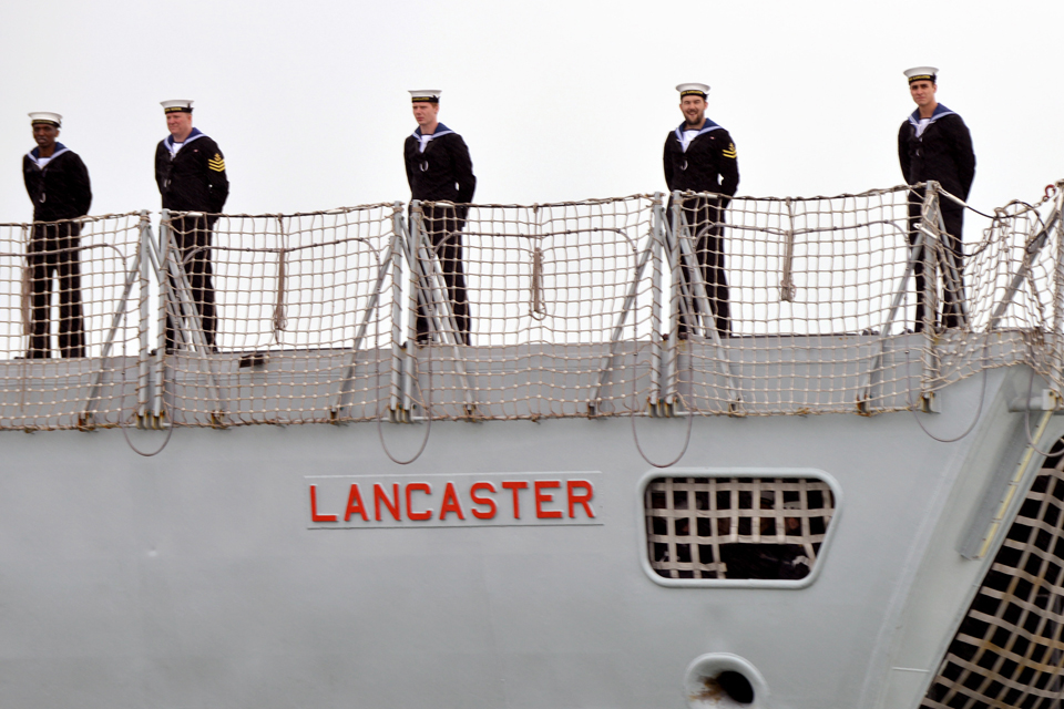 Sailors line the deck as HMS Lancaster leaves Portsmouth