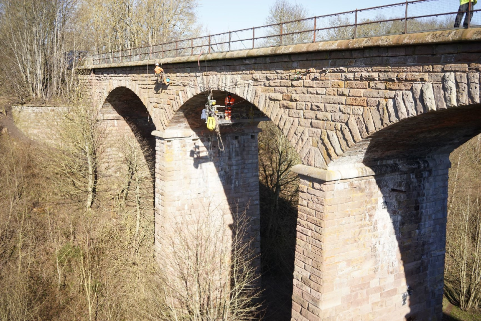 Engineers using ropes and cradles to safely carry out the repair work at Twizel viaduct