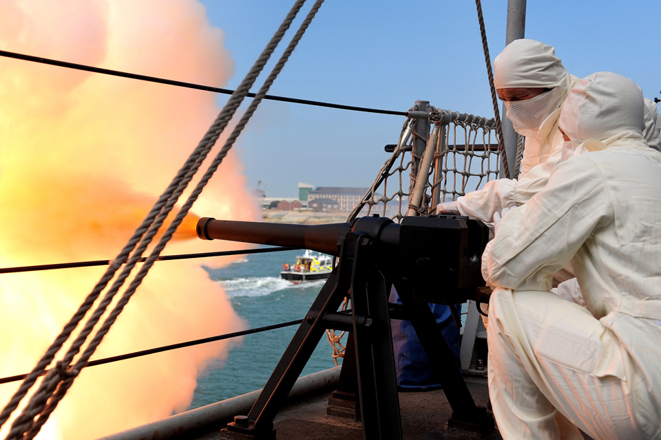 Gunners fire a 21-gun salute from HMS Edinburgh