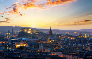 A landscape image of the Edinburgh city skyline at dusk