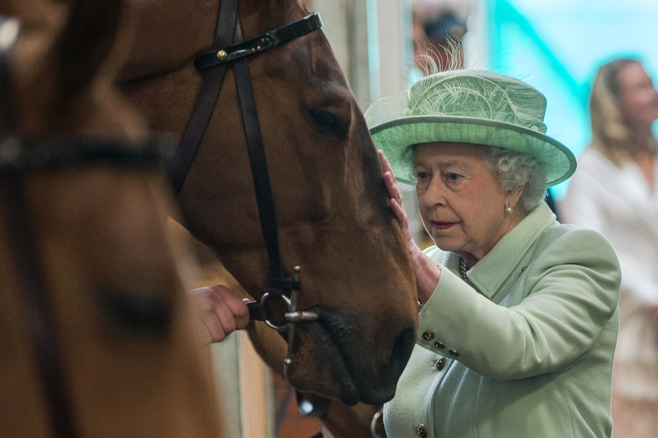 Her Majesty The Queen with a horse
