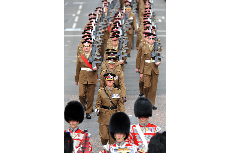 Members of the 1st Battalion Scots Guards parading through Glasgow