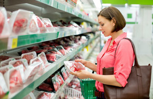 Person buying meat at a supermarket