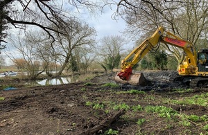 A digger working on one of the FIP projects along the river bank.