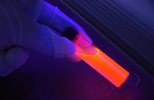 Image of a science lab with a glowing tube