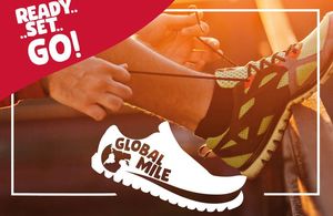 lacing up running shoes for global mile