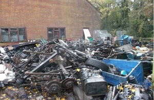 Stockpiled end of life motor vehicles and vehicle parts at Colin Barnes site.