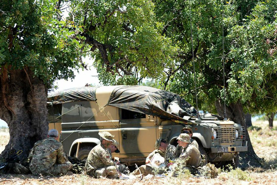 Riflemen take a break in the 37-degree heat