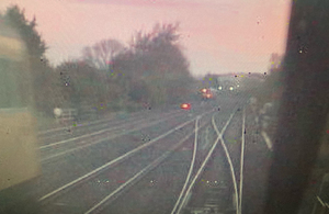 CCTV image from the rear of the train of empty coaches, showing the rail grinding train, travelling towards the junction, on the left (courtesy of East Midlands Trains)