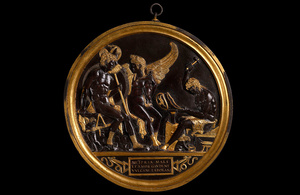 An image of a bronze roundel depicting figures from Roman mythology