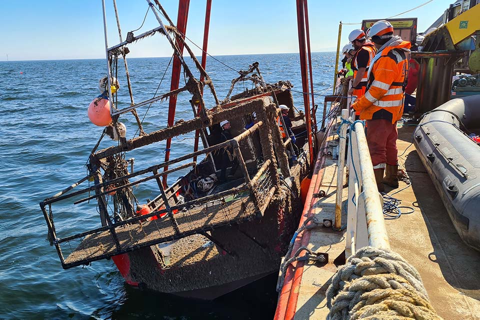 Fishing vessel Nicola Faith being recovered onto the crane barge