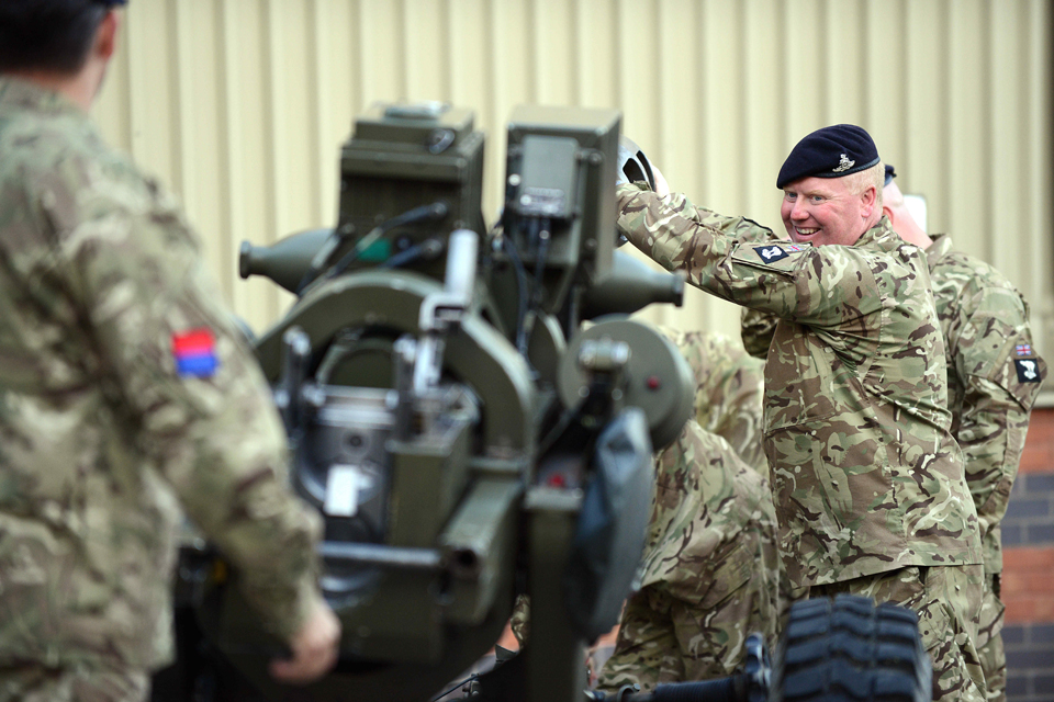 TA soldiers prepare their 105-millimetre light gun for firing