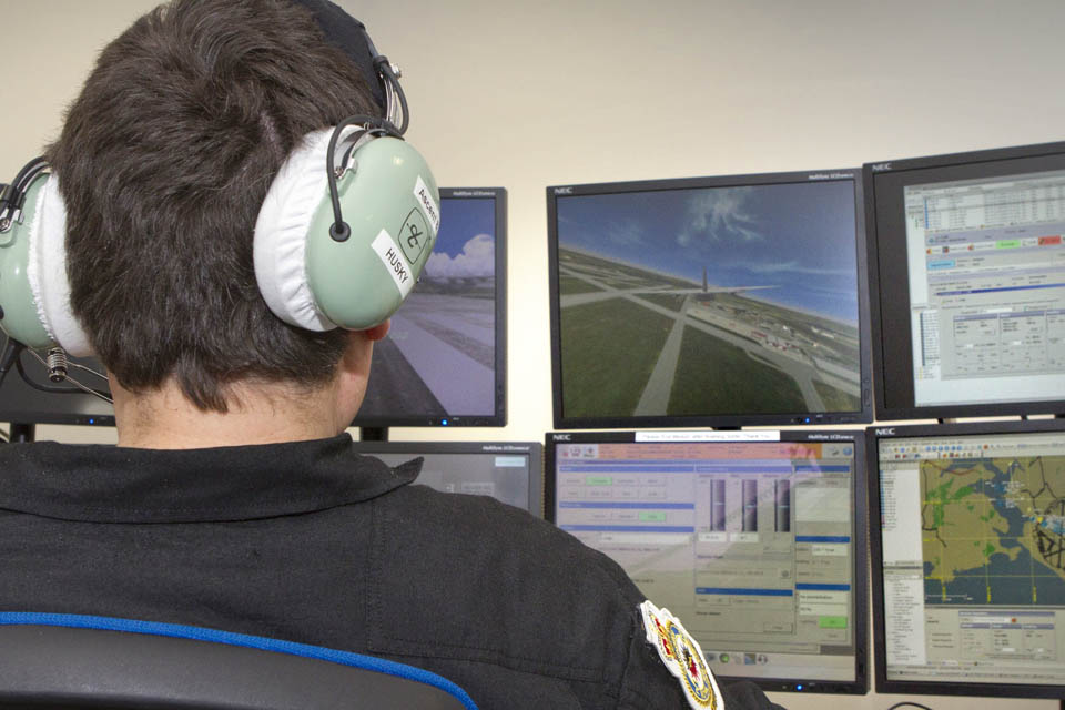 Pilot using a fast jet simulator
