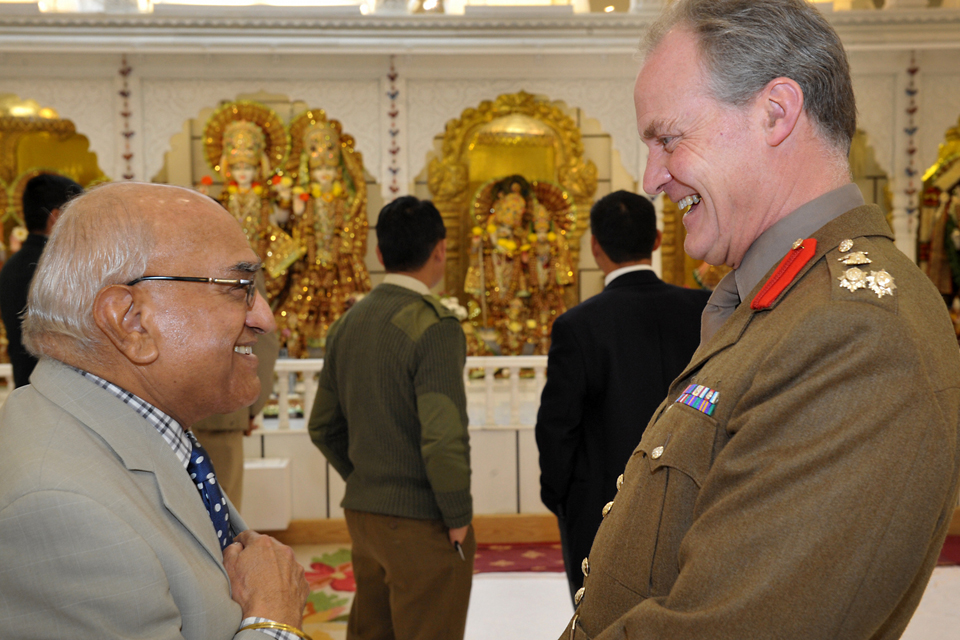 Brigadier Greville Bibby shares a joke with Dr Achhar Paul Dharni