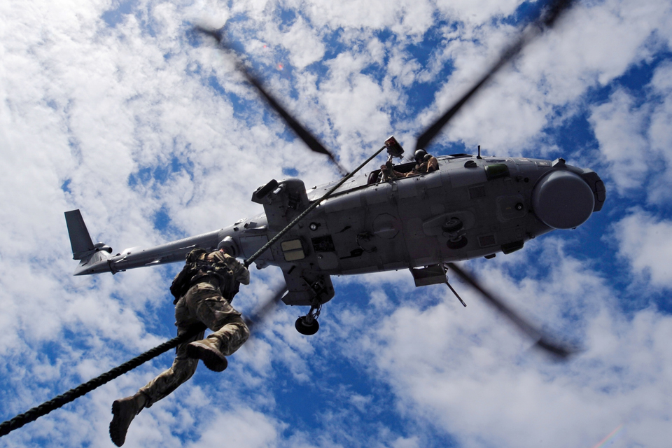 Rapid roping from a Royal Navy Lynx helicopter