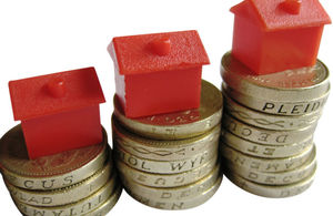 Buildings on stacked coins