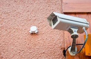 Picture of a CCTV camera on the side of a pub