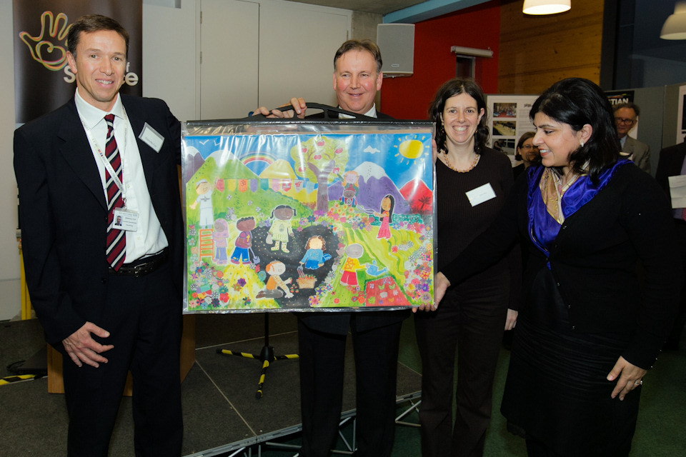 Painting of children planting a peace garden