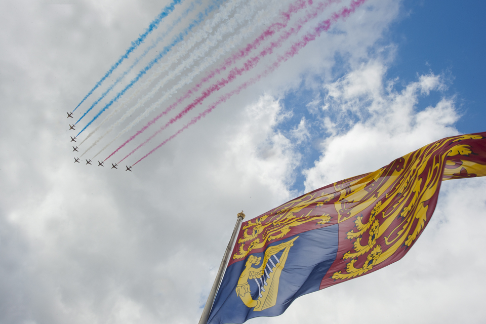 The Red Arrows fly over Buckingham Palace and over the Royal Standard