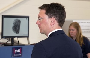 Aviation Minister Robert Courts viewing security scanning equipment at Dstl