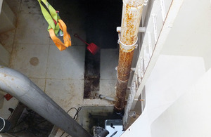Looking down into enclosed space on board a fishing vessel