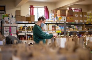 Man organises items at food bank in UK