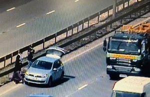 A vehicle stopping for a tyre change in the outside lane of the M1