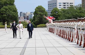 Defence Secretary Ben Wallace is presented with a Guard of Honour in Japan