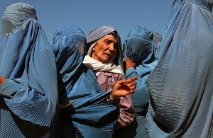 Women line up to collect bags of split chick pea, wheat, and cooking oil being distributed by the UN World Food Programme (WFP) in Herat, Afghanistan. Picture: UN Photo/Eric Kanalstein