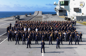 Royal Navy personnel on the deck of an aircraft carrier