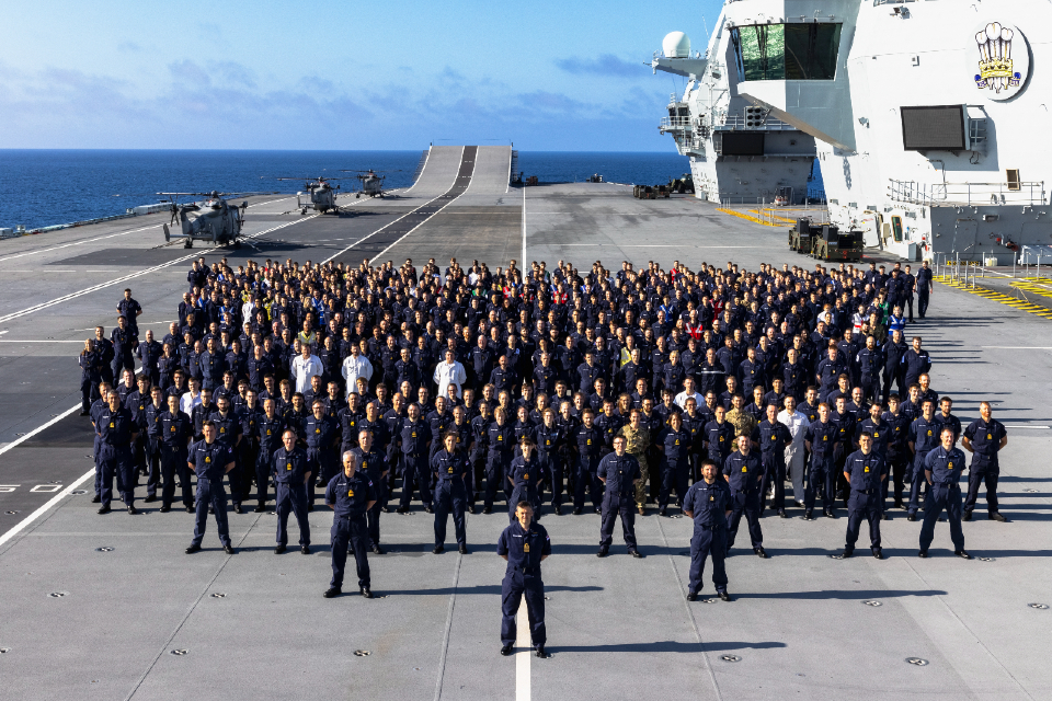 Royal Navy personnel on the deck of an aircraft carrier