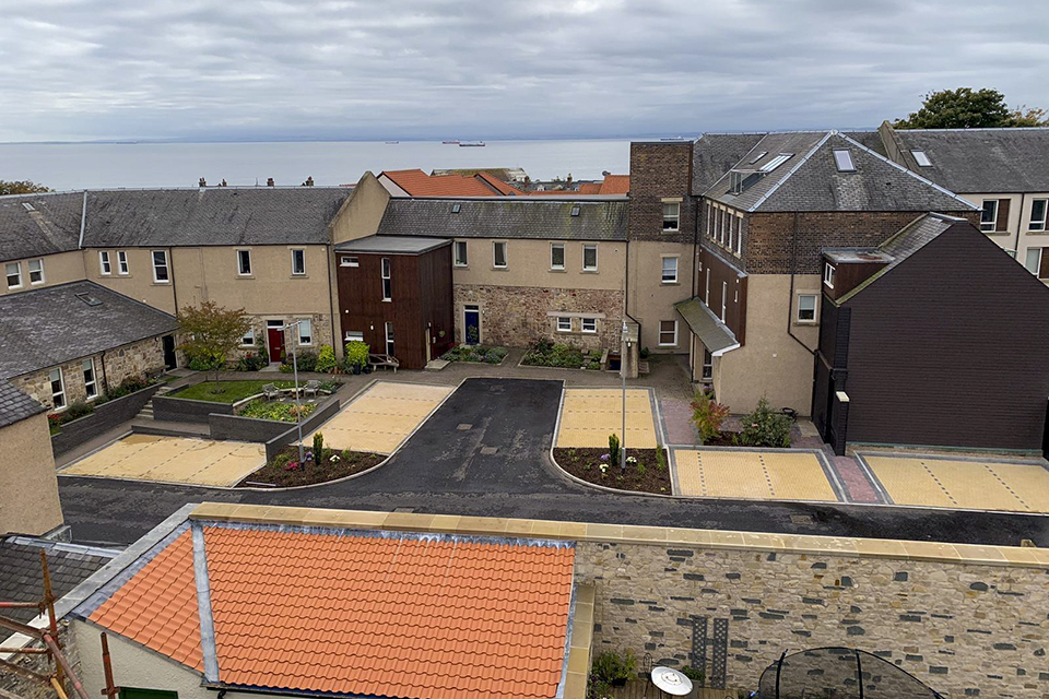 The finished project, after the car park had been reconstructed, with the new boundary wall in the foreground of the picture