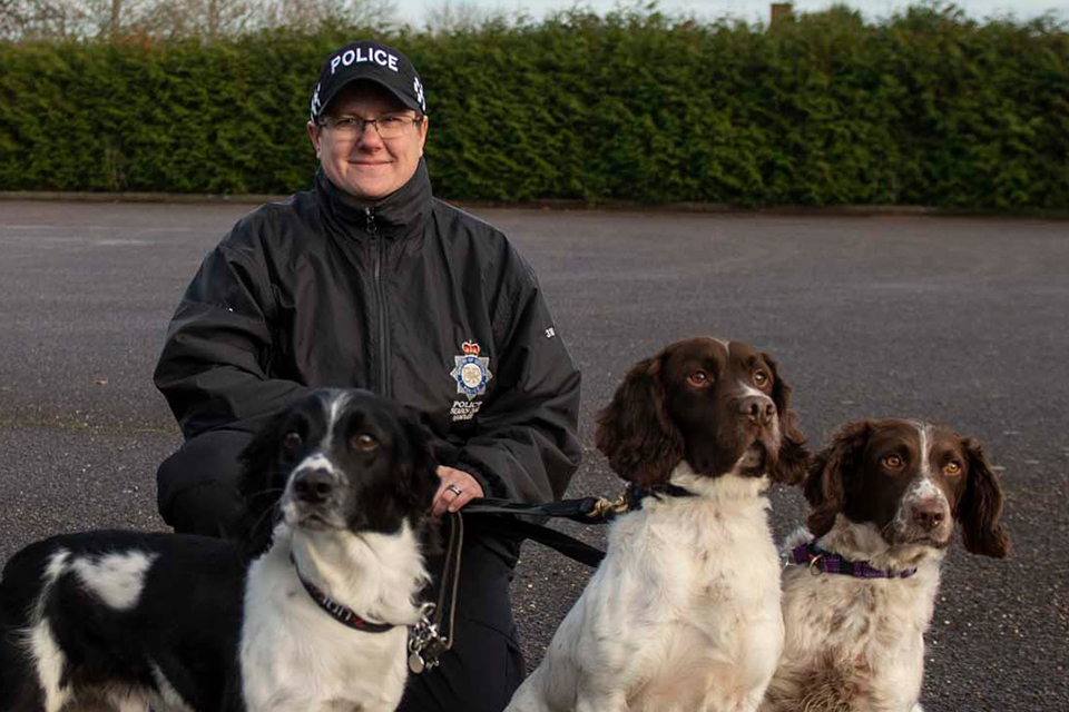 The MDP’s first female Dog Training Instructor, Hannah, with police dogs  