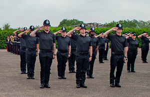 Ministry of Defence Police new recruits saluting on parade ground
